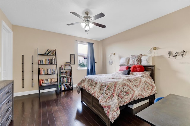 bedroom featuring dark hardwood / wood-style flooring and ceiling fan