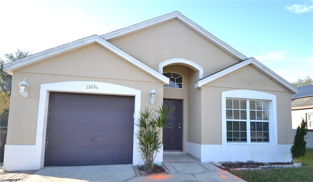 ranch-style house featuring a garage