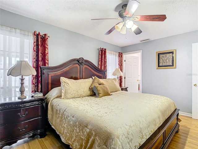 bedroom featuring ceiling fan and light hardwood / wood-style floors