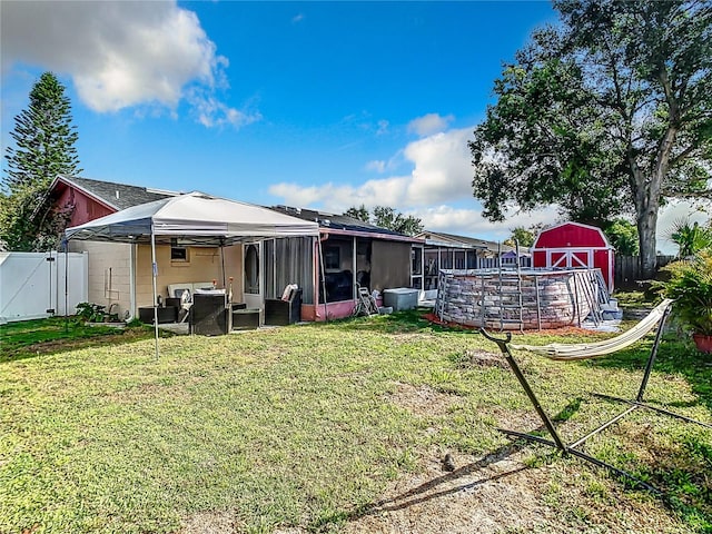 rear view of property with a yard