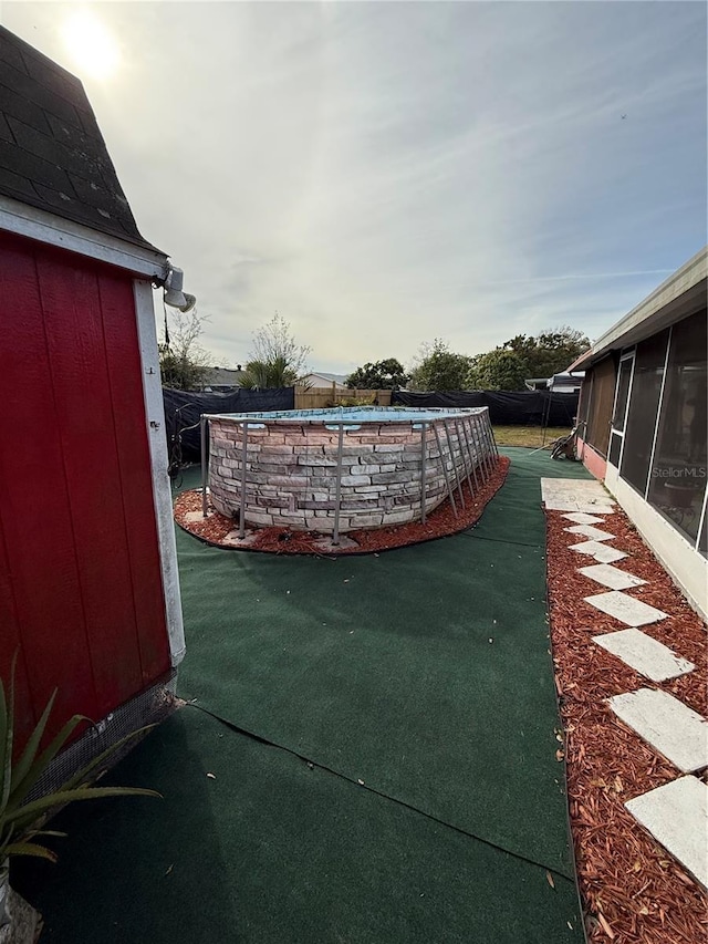 view of yard with a sunroom