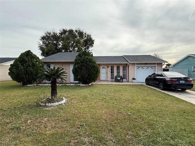 ranch-style house featuring a front lawn and a garage