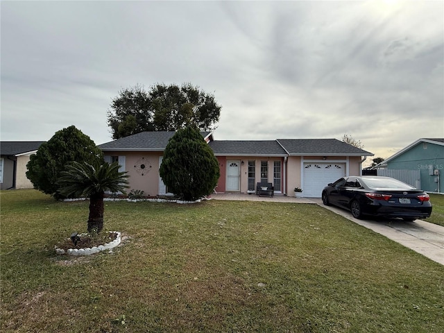 single story home with a garage and a front yard