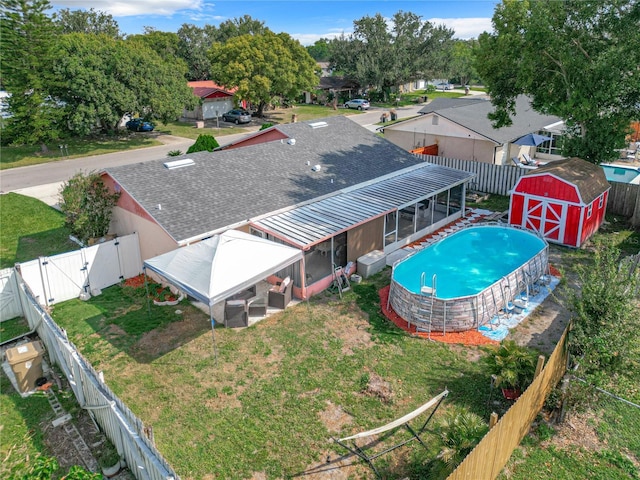 view of swimming pool featuring a shed