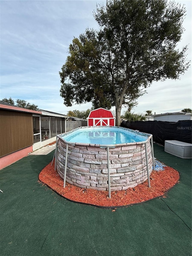 view of property's community with a pool and a shed