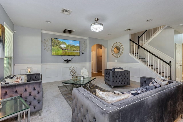 carpeted living room with a textured ceiling