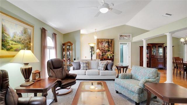 living area with vaulted ceiling, ceiling fan, visible vents, and decorative columns