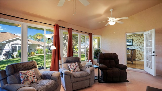 sunroom / solarium with lofted ceiling and ceiling fan