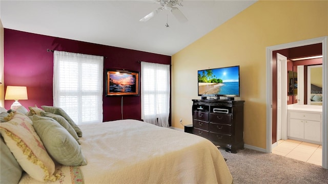 bedroom with carpet floors, vaulted ceiling, baseboards, and a ceiling fan