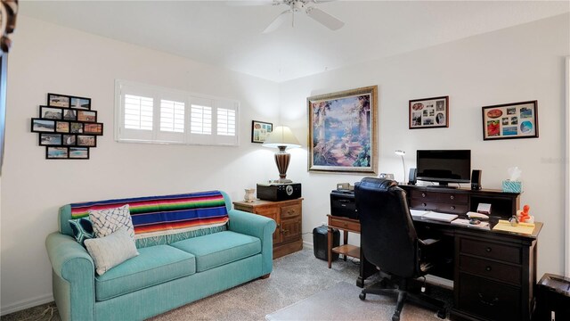 home office with a ceiling fan and carpet flooring