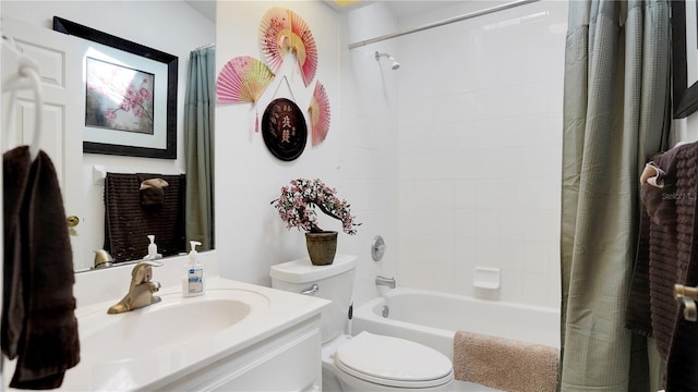 bathroom with shower / tub combo, vanity, and toilet