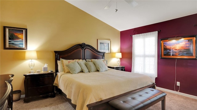 carpeted bedroom featuring baseboards, vaulted ceiling, and a ceiling fan