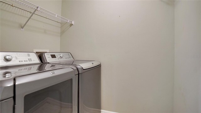 laundry area with laundry area and washing machine and dryer