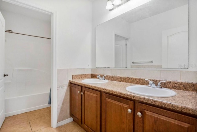 bathroom with  shower combination, vanity, and tile patterned floors