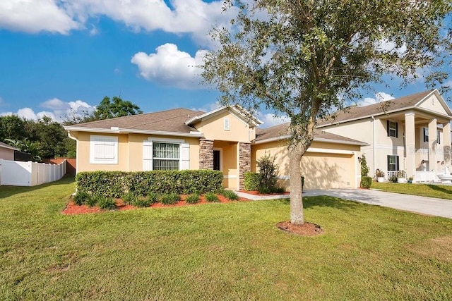 view of front of property with a front yard and a garage