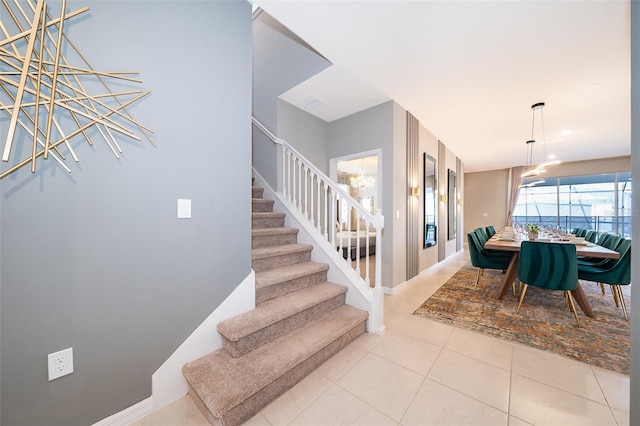 stairs with tile patterned floors