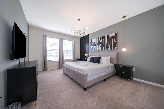 carpeted bedroom featuring a chandelier