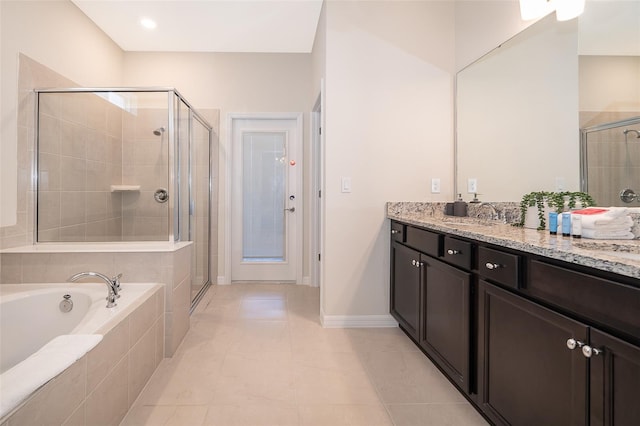 bathroom featuring vanity, tile patterned floors, and separate shower and tub