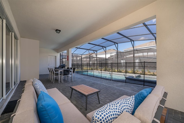 view of patio / terrace featuring a lanai