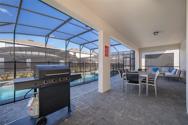 view of patio with a lanai and grilling area