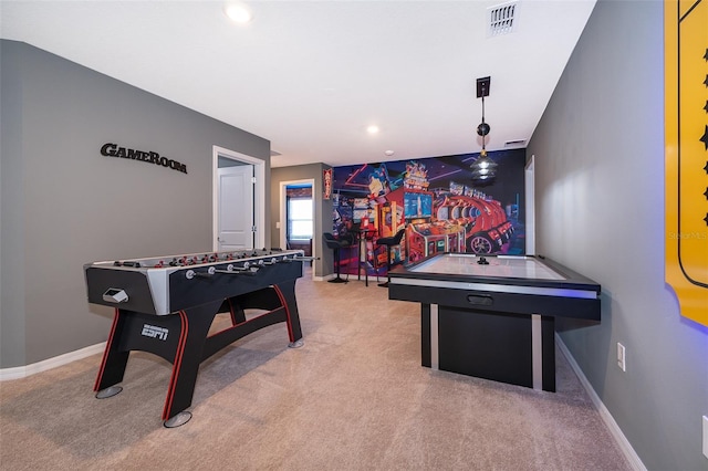 recreation room with light colored carpet