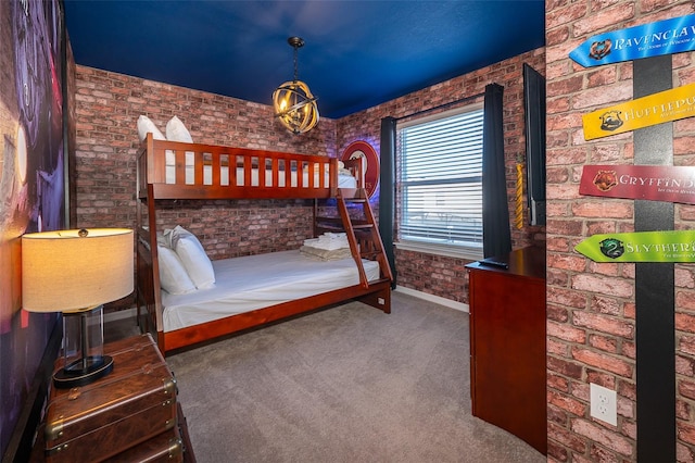 carpeted bedroom with brick wall