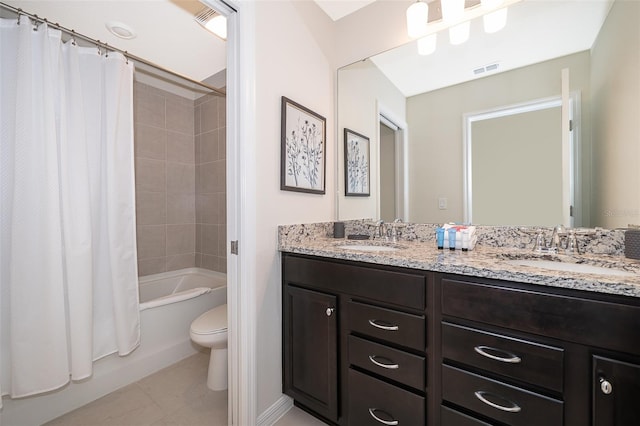 full bathroom featuring vanity, shower / bath combo with shower curtain, and toilet