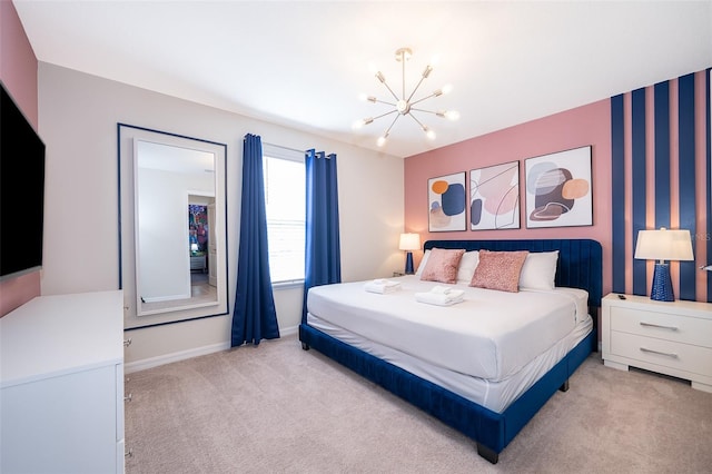 bedroom with an inviting chandelier and light colored carpet