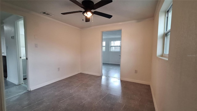 empty room with ceiling fan and ornamental molding