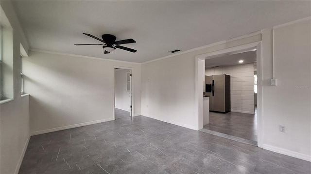 spare room with ceiling fan and ornamental molding