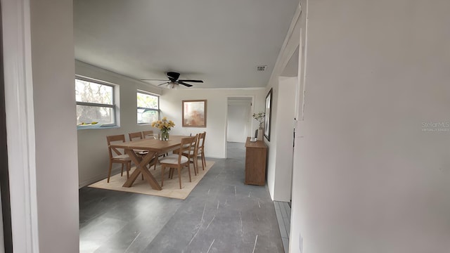 dining space with ceiling fan