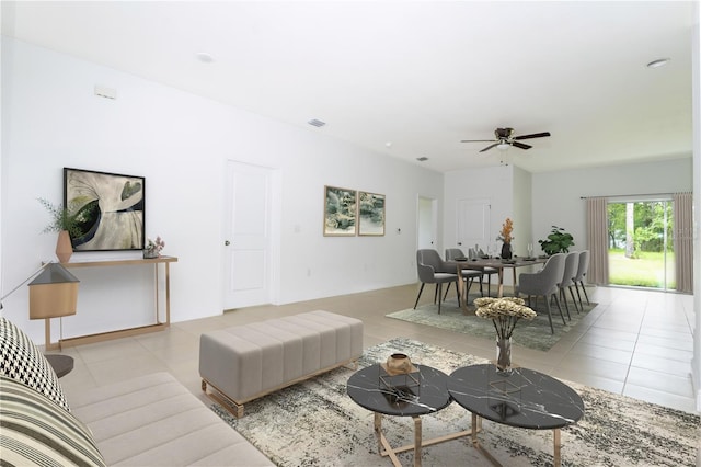 living room featuring ceiling fan and light tile patterned floors