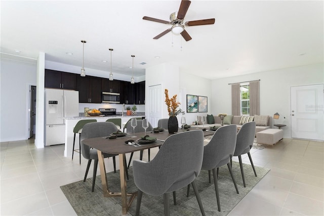 dining area featuring ceiling fan and light tile patterned floors