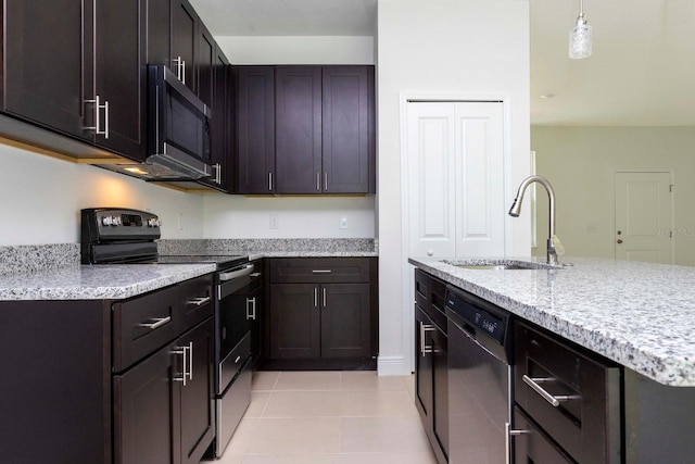 kitchen featuring sink, stainless steel appliances, dark brown cabinetry, decorative light fixtures, and light tile patterned floors