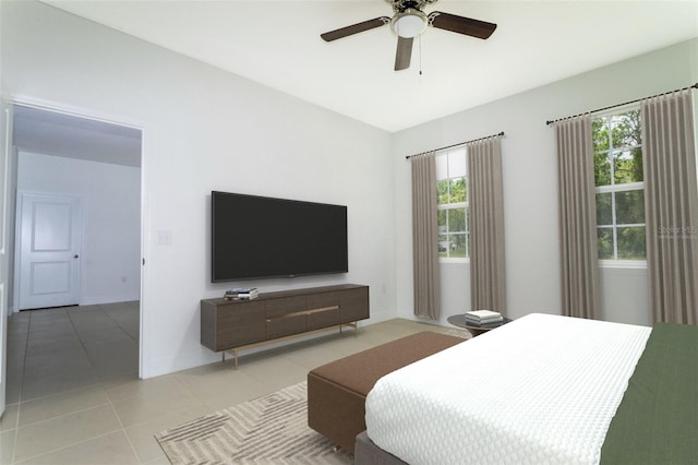 bedroom featuring light tile patterned flooring and ceiling fan