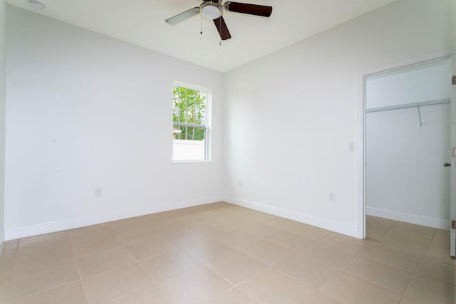 unfurnished bedroom featuring ceiling fan and light tile patterned flooring