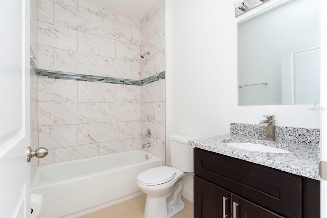 full bathroom with tiled shower / bath, vanity, toilet, and tile patterned flooring