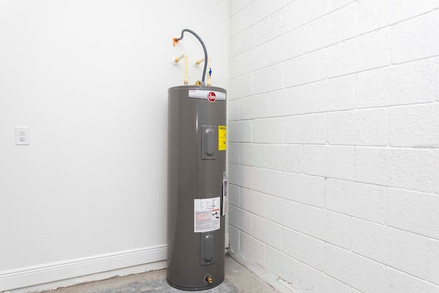 utility room featuring electric water heater