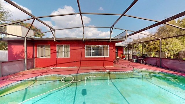 view of pool featuring a patio and a lanai