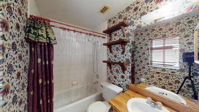 full bathroom featuring vanity, toilet, and shower / tub combo with curtain