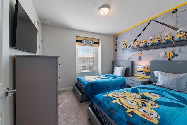 bedroom featuring carpet and a textured ceiling