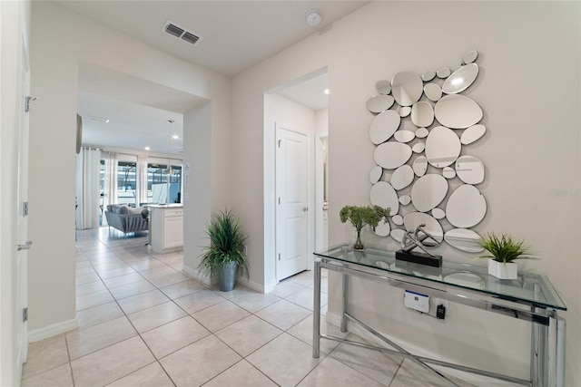 corridor with light tile patterned flooring