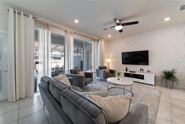 tiled living room featuring ceiling fan