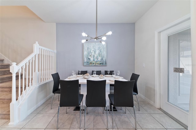 dining area with light tile patterned flooring and a notable chandelier