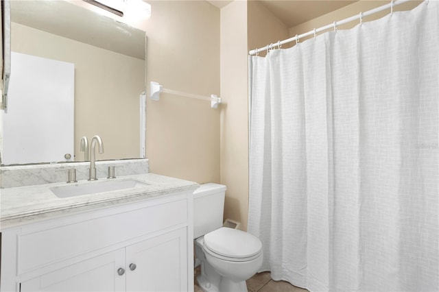 bathroom featuring vanity, toilet, a shower with curtain, and tile patterned flooring