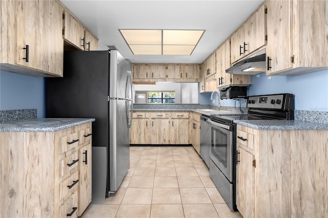 kitchen featuring stainless steel appliances, light tile patterned floors, and light brown cabinets