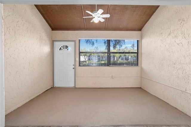 interior space with ceiling fan