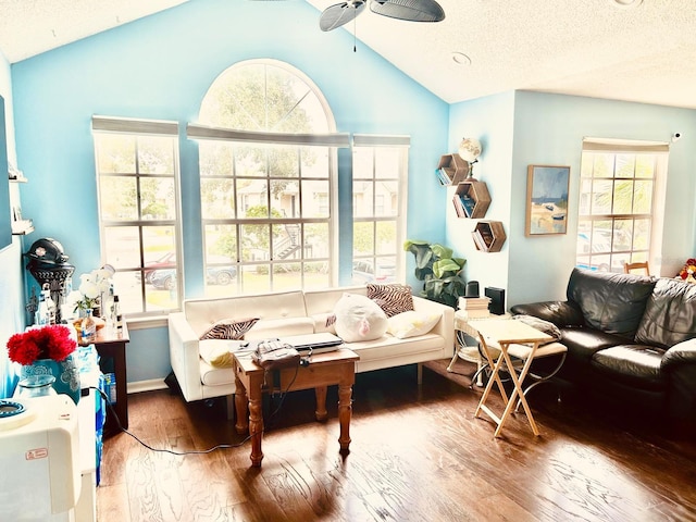 sunroom featuring ceiling fan and vaulted ceiling