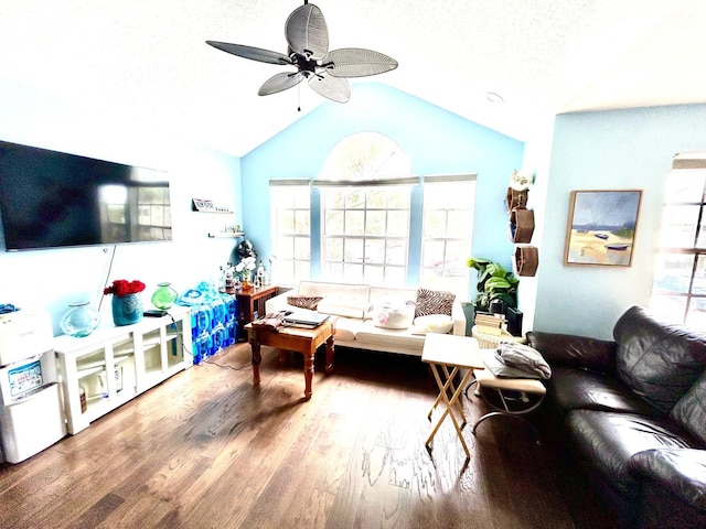 living room with vaulted ceiling, wood-type flooring, and ceiling fan