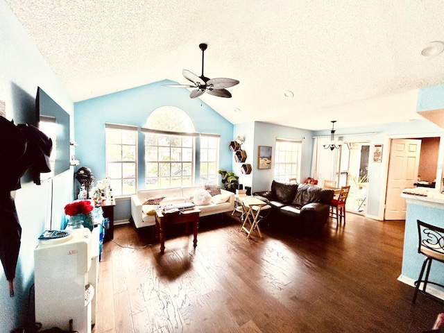 living room with ceiling fan, a textured ceiling, lofted ceiling, and dark hardwood / wood-style flooring